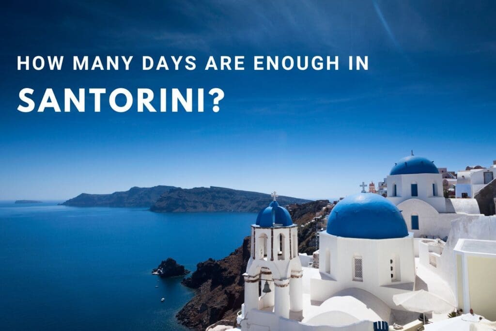 A stunning view of the Caldera in Santorini, featuring iconic blue-domed churches and the crystal-clear Aegean Sea.