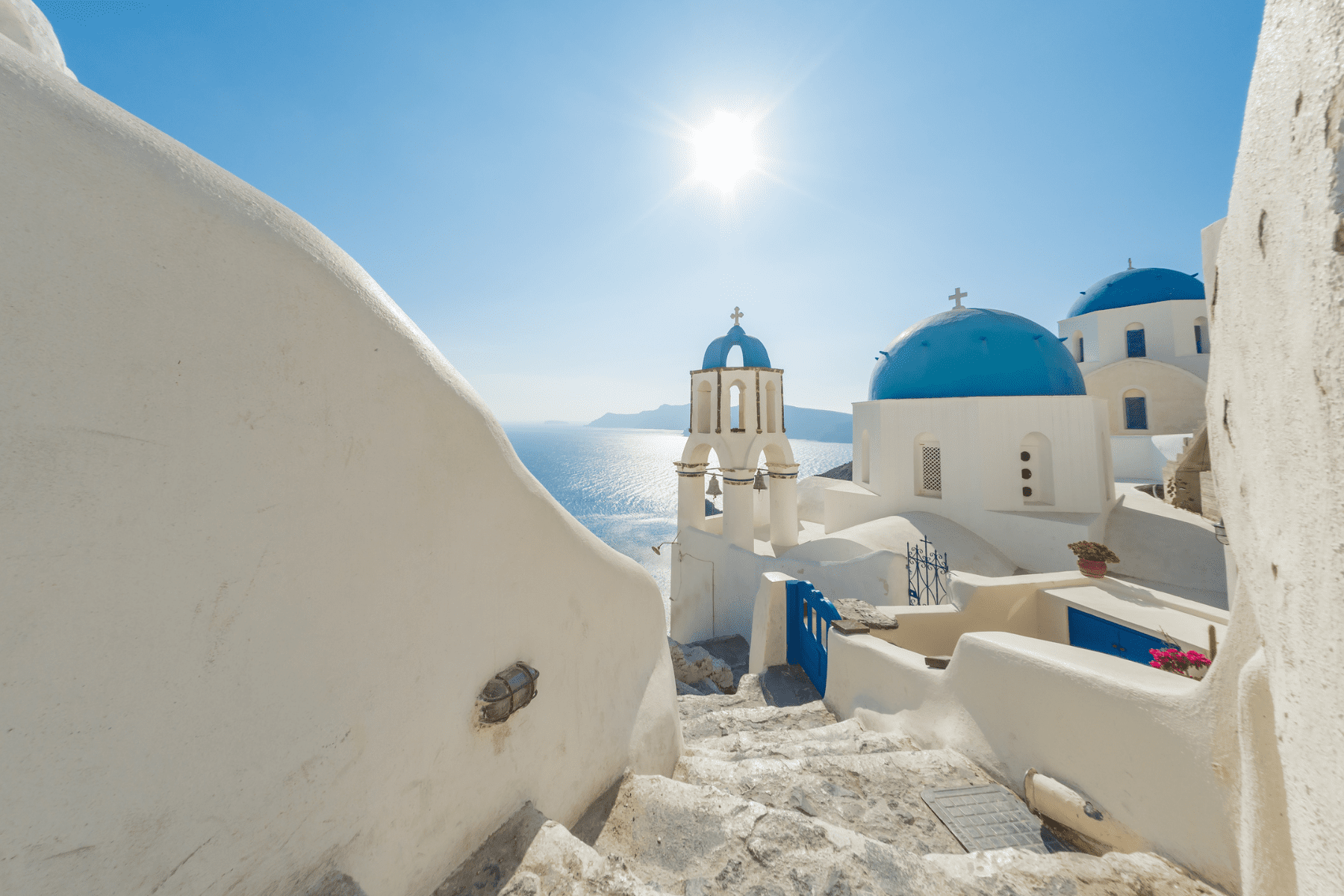 Santorini Dreamscape Whitewashed buildings with blue domes in Oia, Santorini.