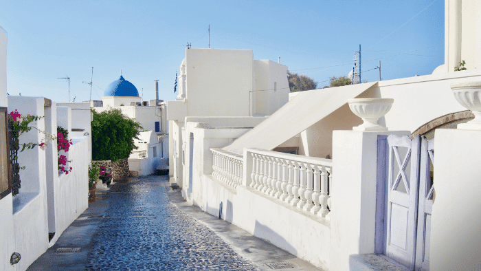 Traditional cobblestone street in Megalochori village, Santorini.